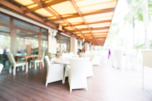 Free photo blurred outdoor chairs and tables