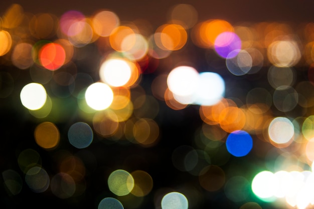 Free Photo blurred street bokeh lights at night time