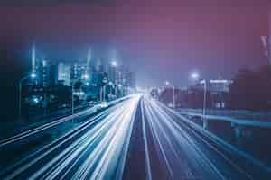 Free photo blurred traffic light trails on road