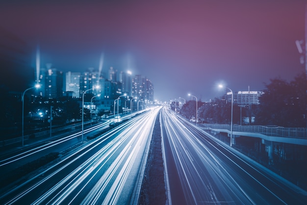 Free Photo blurred traffic light trails on road