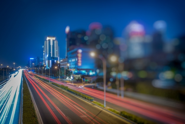 blurred traffic light trails on road