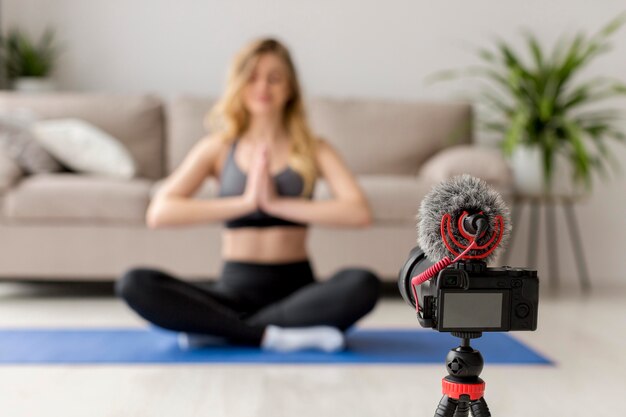 Blurred woman on yoga mat