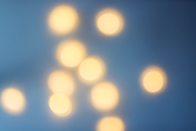 Free photo blurred yellow bokeh background