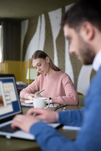 Blurry man working with laptop