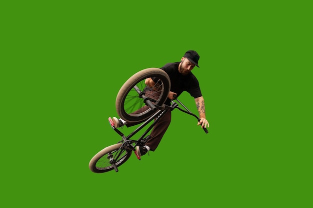 Free photo bmx rider is performing tricks