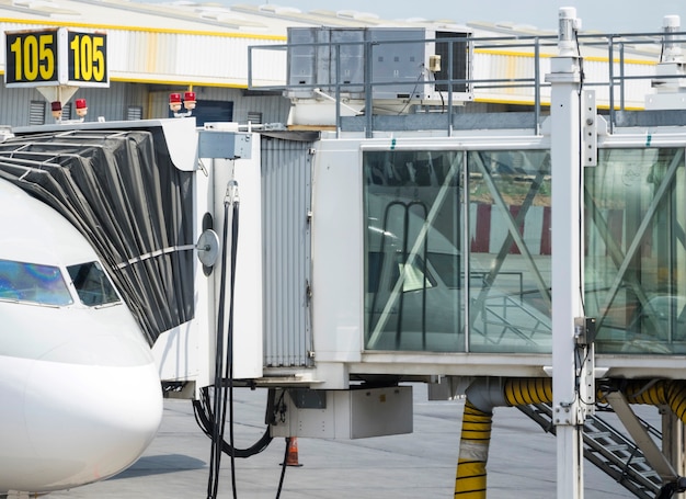 Free photo boarding bridge connected to airplane