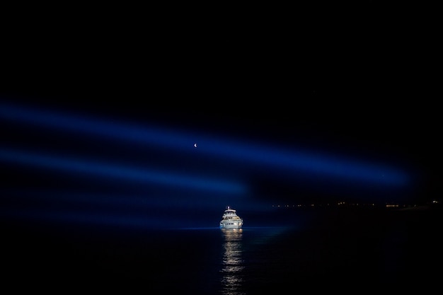 "Boat sailing in night sea"