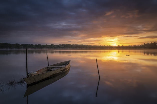 Boat on the shore at sunrise