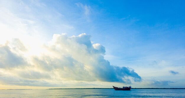 Boat on tropical river with blue sky