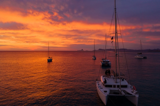 Free Photo boats shipping in sea at sunset