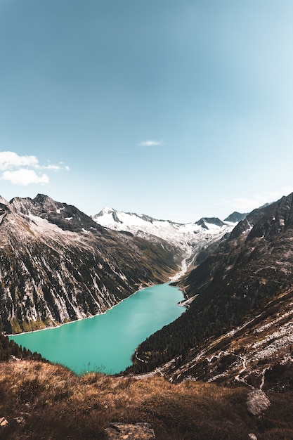 Free Photo body of water between mountain