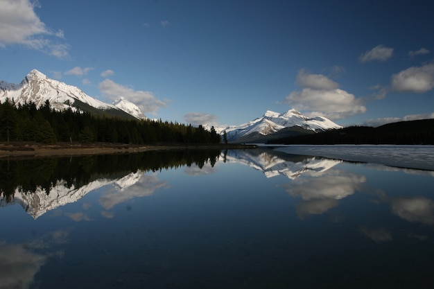 Body of water surrounded by clouds in Banff and Jasper National Parks