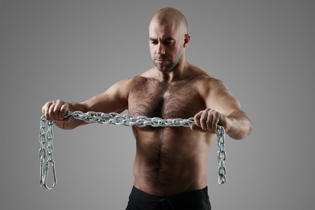 Bodybuilder posing and showing muscles