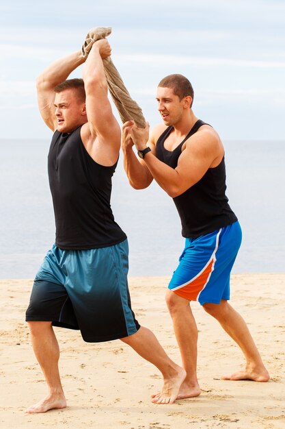 Bodybuilders on the beach