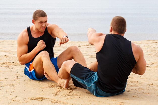 Bodybuilders on the beach