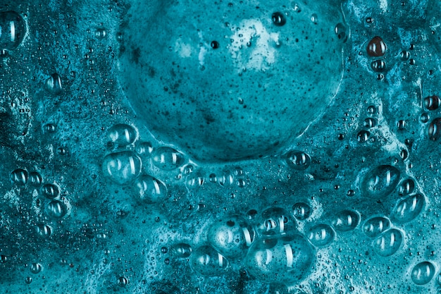 Free photo boiling blue liquid with foam and big blob