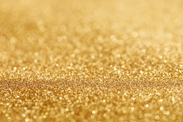 Free photo bokeh light of gold glitters