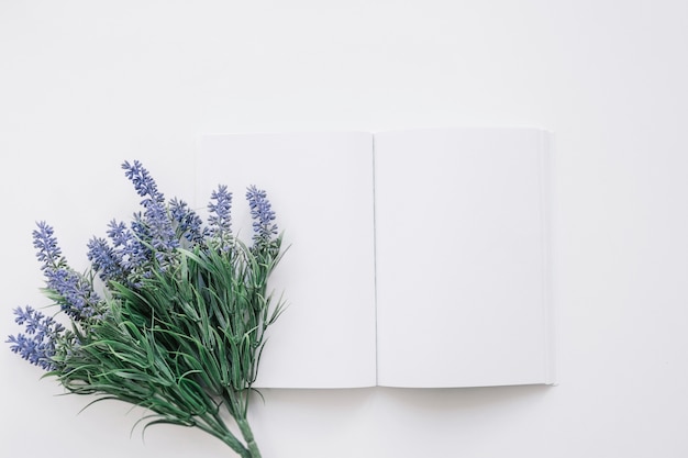 Free photo book cover mockup with flower on left