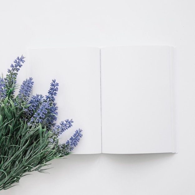 Free photo book cover mockup with natural flowers