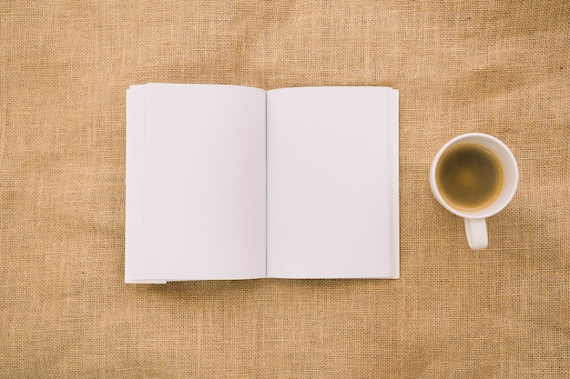 Book mockup on cloth with coffee