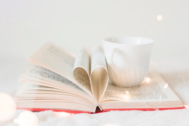 Book with its pages shaping as a heart