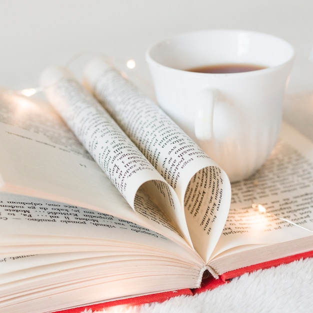 Book with its pages shaping as a heart