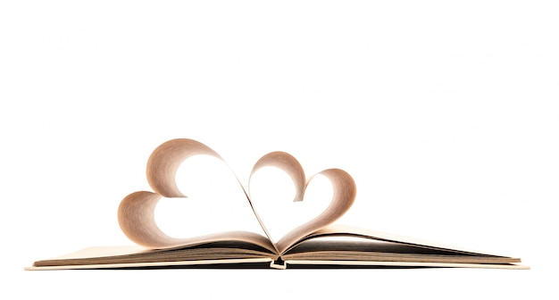 Book with opened pages of shape of heart isolated on white backg