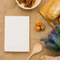 Free photo booklet mockup with bread and cinnamon