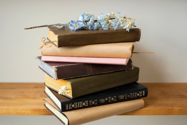 Free photo books arrangement with blue flower