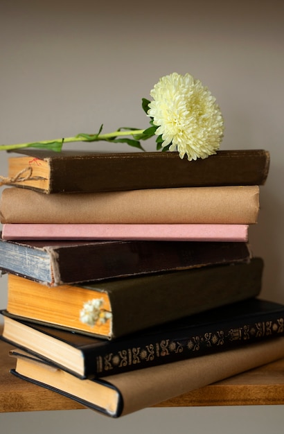 Books arrangement with flower