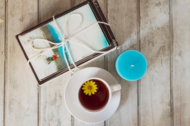 Free Photo books, candle and coffee with flower inside