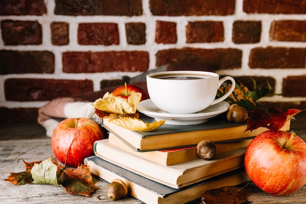 Books and coffee in foliage