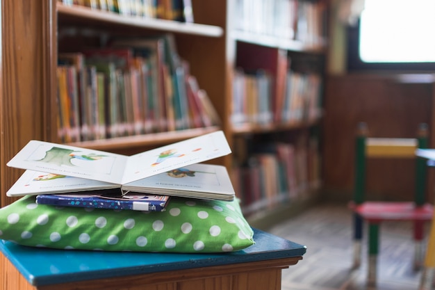 Free photo books lying on pillow in library