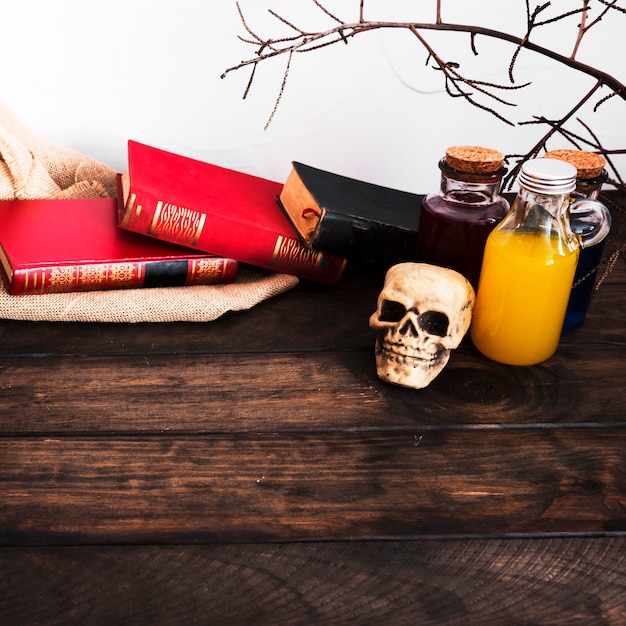 Books and potions on wooden table