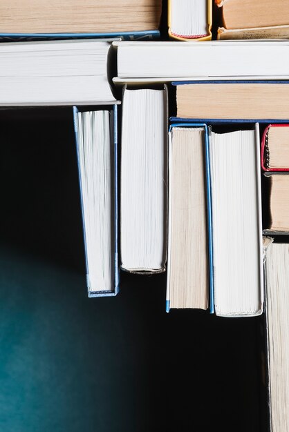 Books stacked on blue background