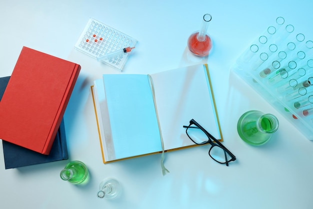 Free photo books with chemical test tubes on the table