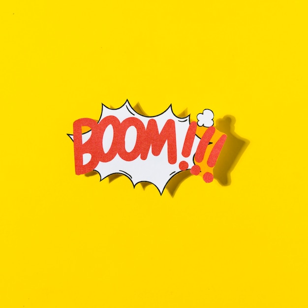 Free photo boom cartoon illustration text in retro pop art style on yellow background