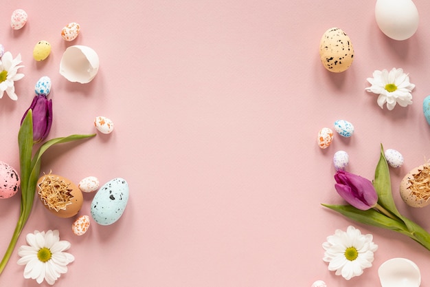 Free photo border of flowers and painted eggs