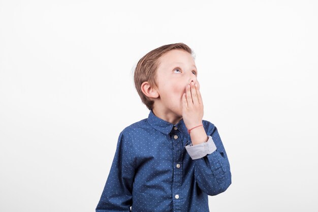 Bored boy in blue shirt