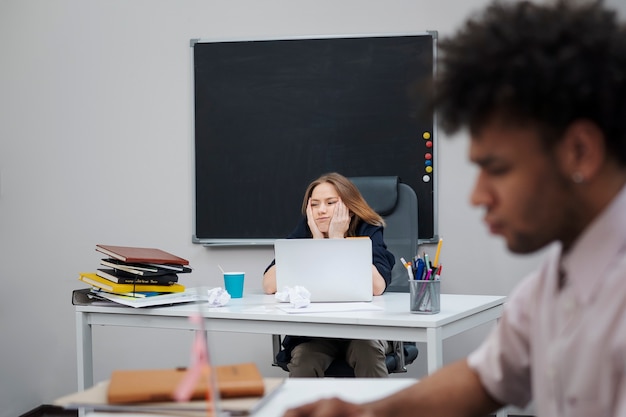 Bored woman sitting at desk