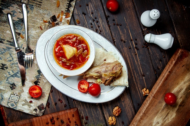 Borsch with meat and sour cream top view