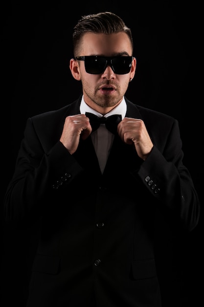 Free photo boss, gentleman. attractive businessman in black suit