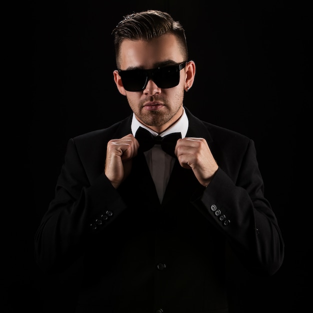 Free photo boss, gentleman. attractive businessman in black suit