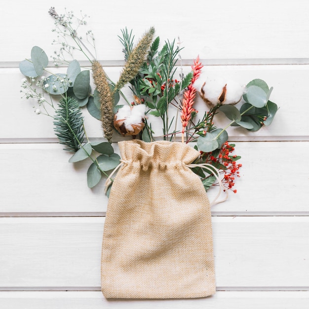 Free photo botanical composition with bag