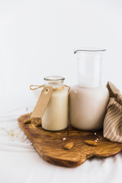 Bottle and glass of milk with nuts