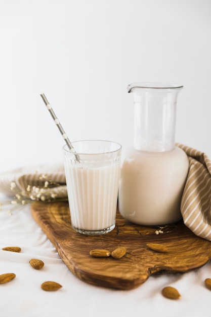 Free photo bottle and glass of milk with nuts