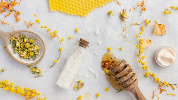 Free Photo bottle and ingredients arrangement flat lay