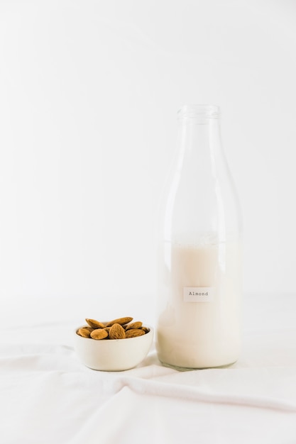 Free photo bottle of milk and nuts