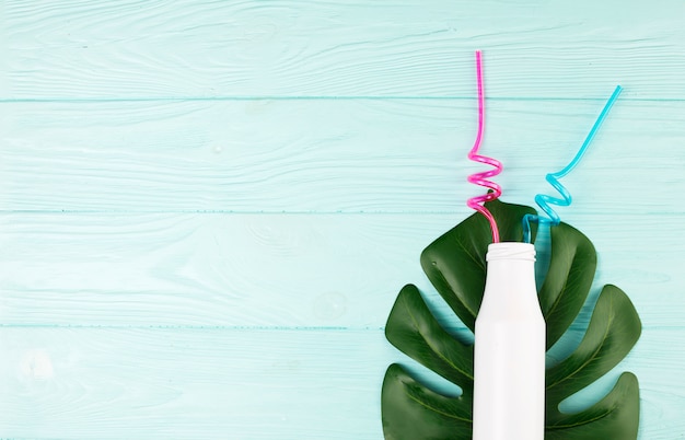 Free photo bottle with straws on lead