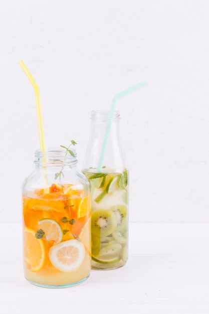 Free photo bottles of fruit drink on table